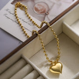 Gold heart beaded necklace