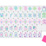 Set of colorful Mahjong tiles with a pink tile on a white background