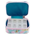 Weekly pill organizer with floral case on a white background