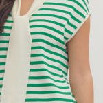 Green and white striped sleeveless top worn by a person