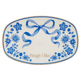 Decorative plate with blue floral patterns and a bow, featuring the text 'things I like'.