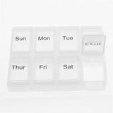 White pill organizer with days of the week labels on a white background