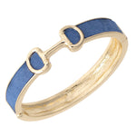 Gold ring with blue ribbon on a white background