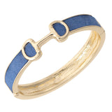 Gold ring with blue ribbon on a white background